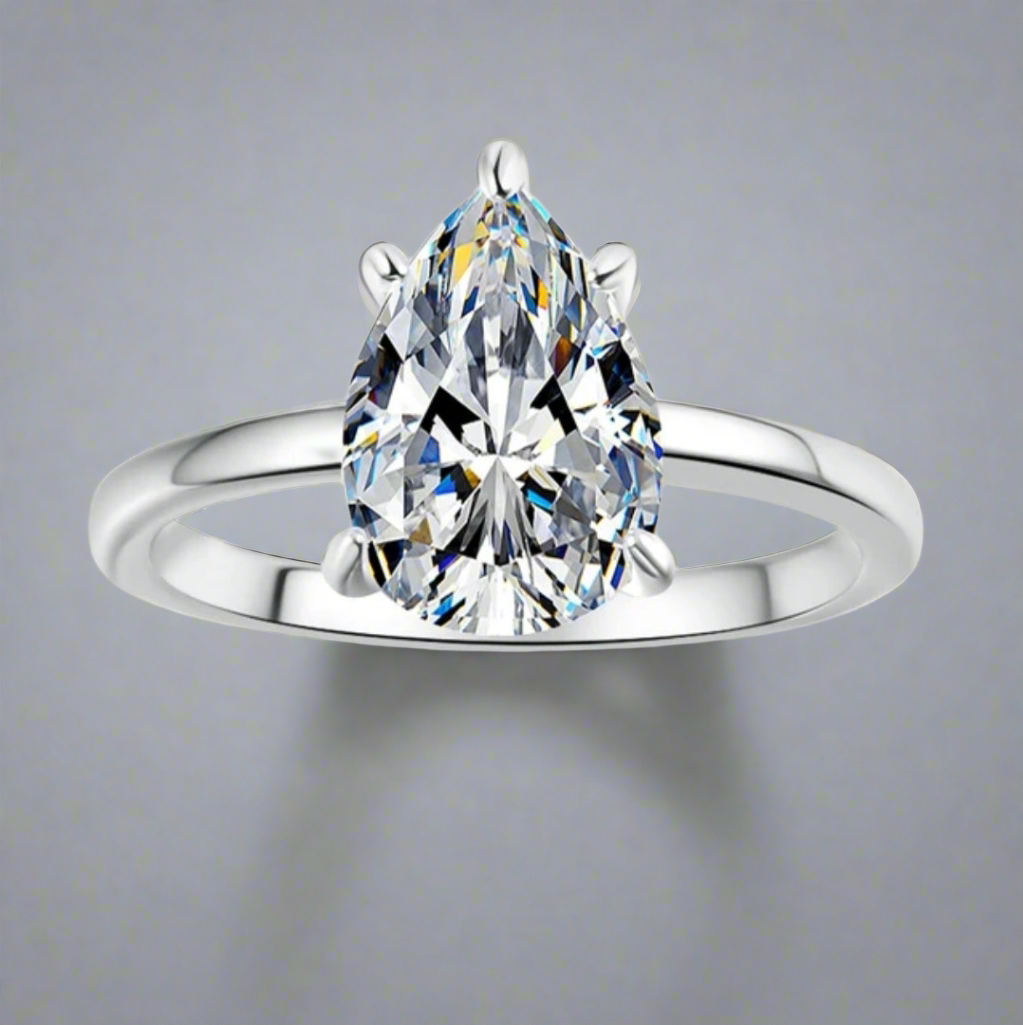 Valencia: 2 Carat D Color VVS1 Moissanite Ring with Pear Cut Solitaire Design