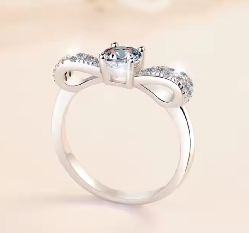 Beau: 0.5 Carat D Color VVS1 Moissanite Ring with Bow-Inspired Design